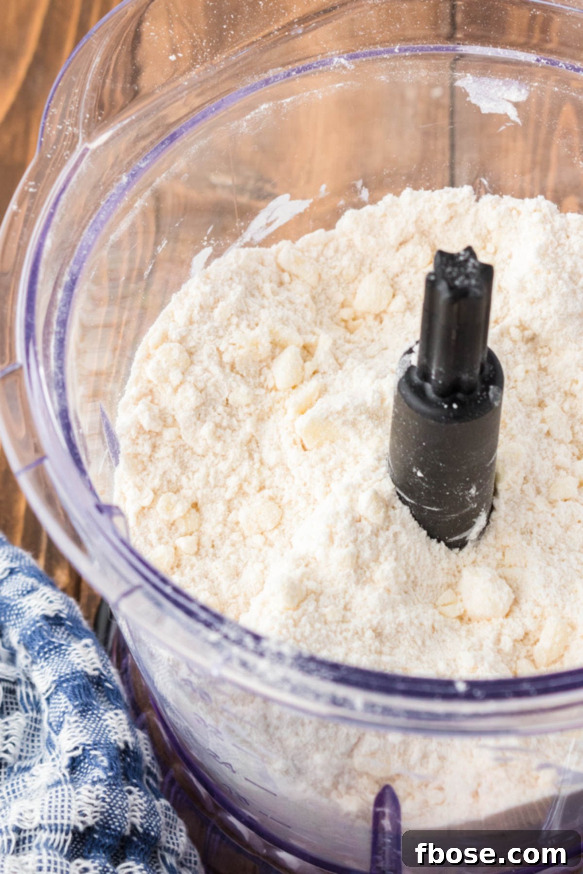 Flour and butter and sugar in a food processor.