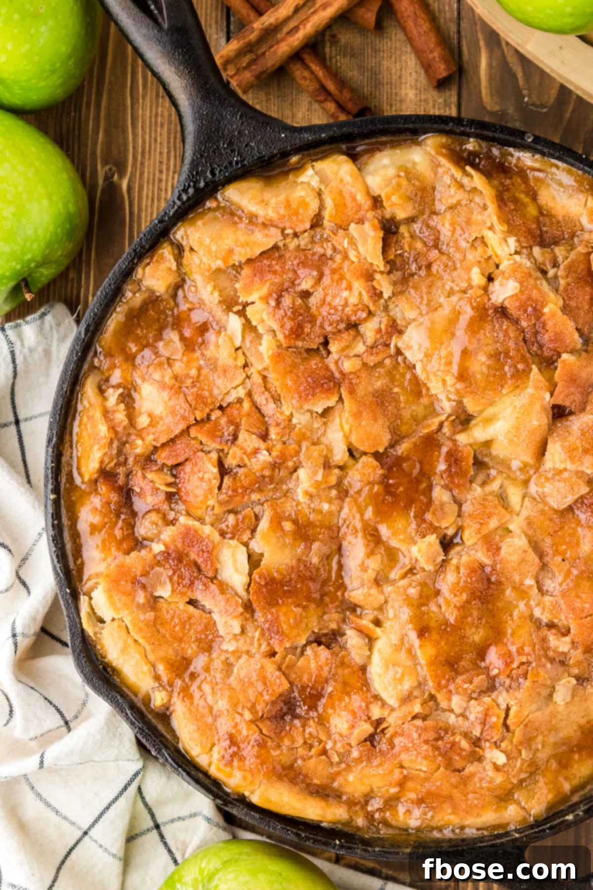 Overhead photo of a cast iron skillet filled with apple pandowdy.