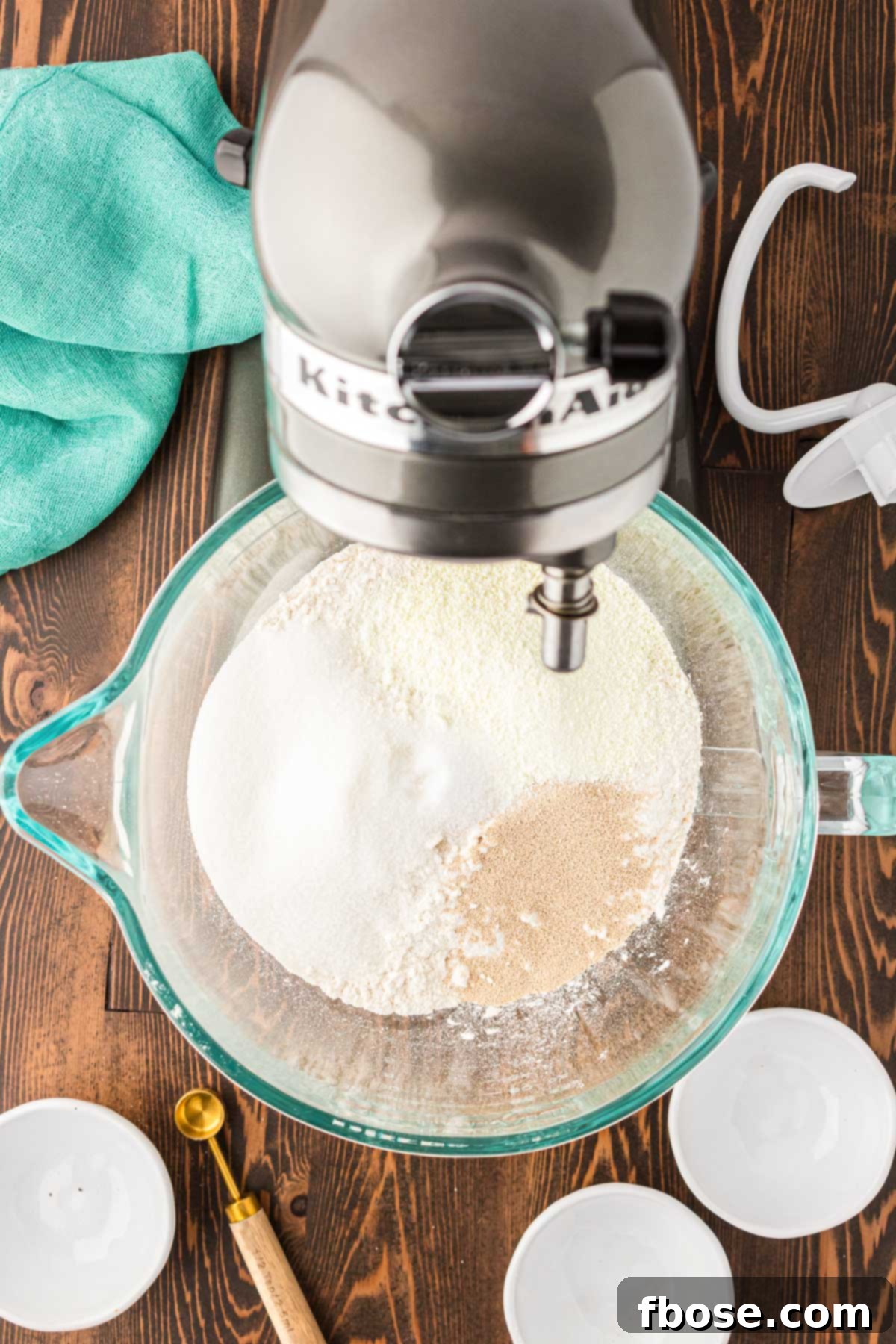 Dry ingredients to make cinnamon rolls in a mixing bowl.