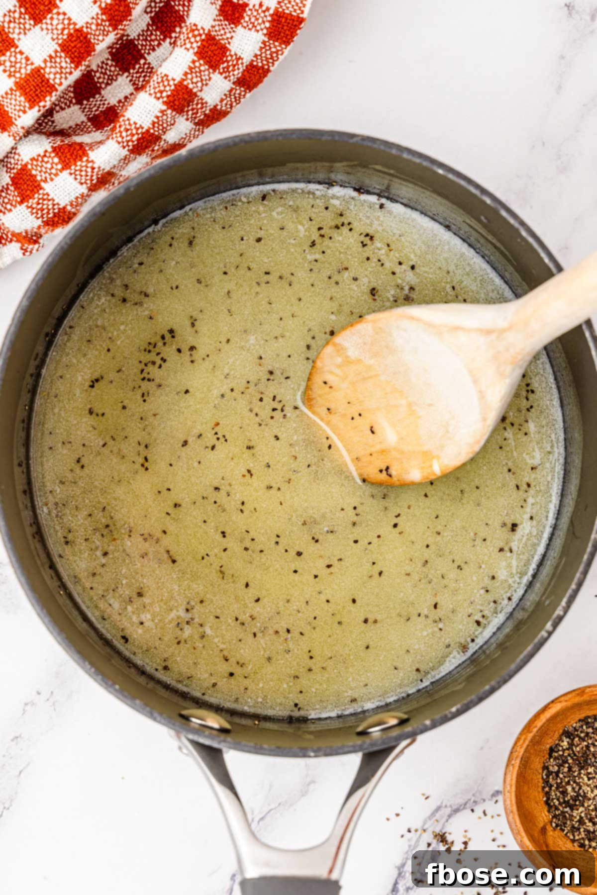 melted butter and black pepper in a saucepan to make gravy.