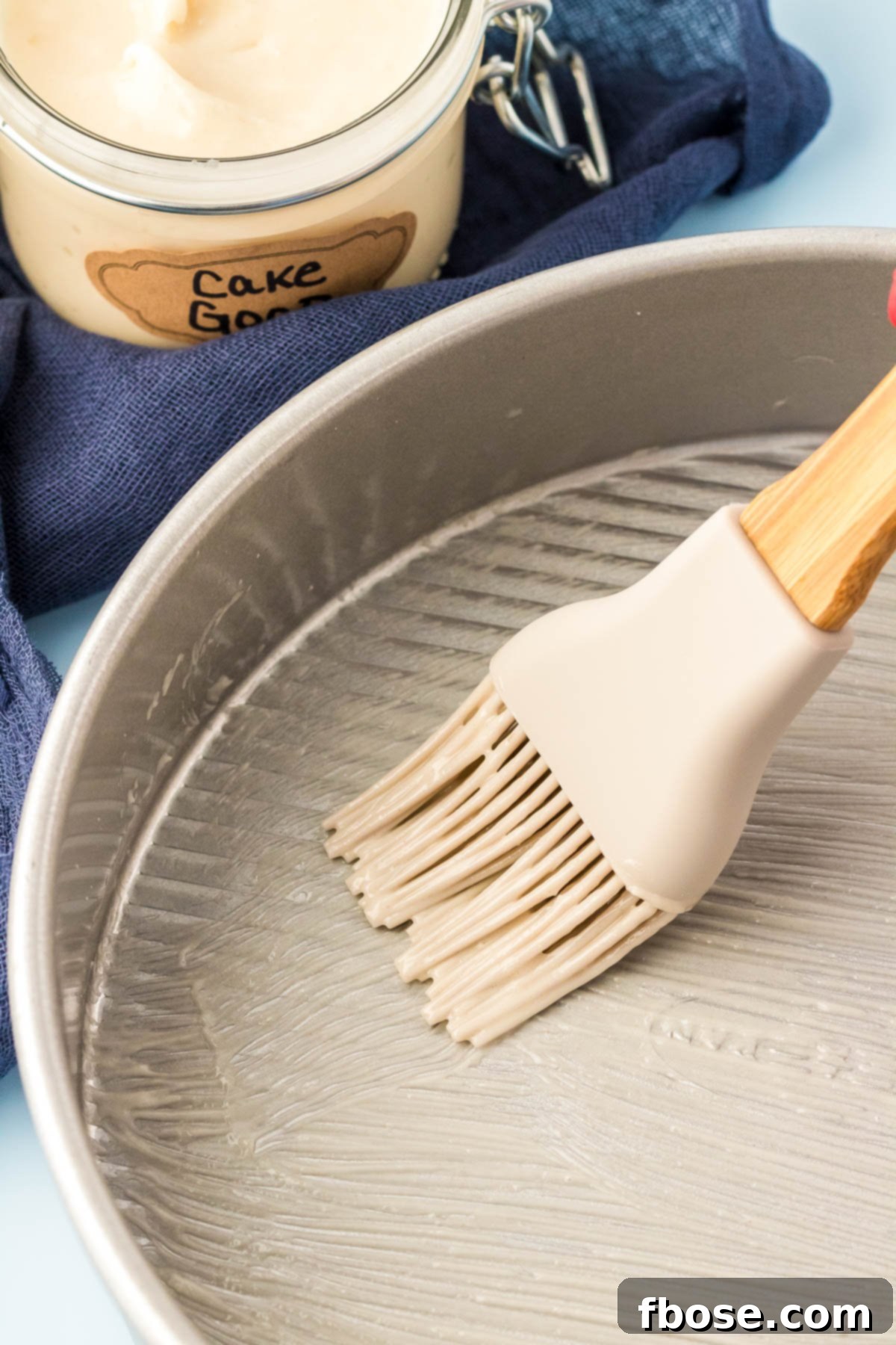 Flawless Cake Release 6 Cake goop being smoothly spread in a cake pan with a pastry brush.