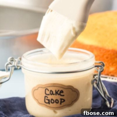 Flawless Cake Release 10 A pastry brush dipping into a jar of cake goop.