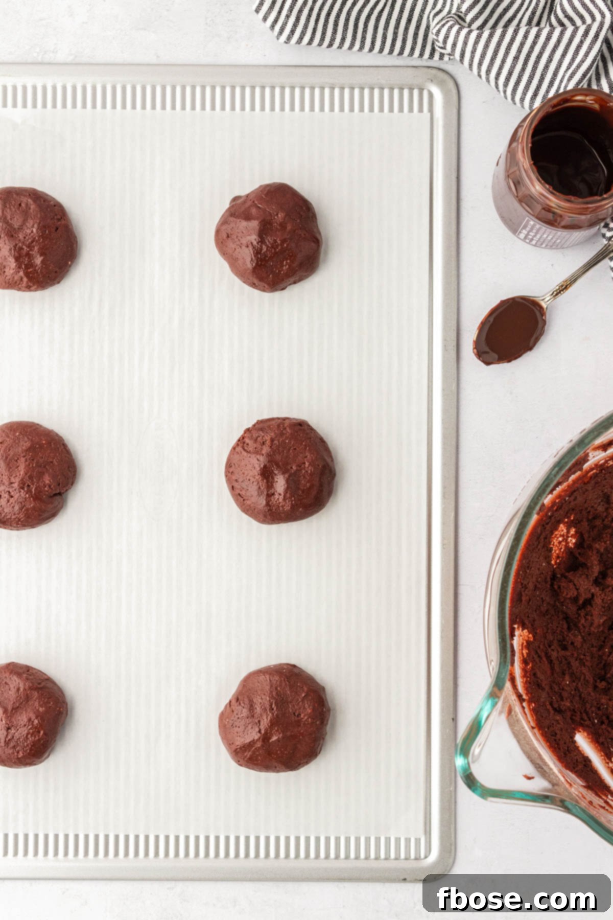 Chocolate lava cookies on a cookie sheet ready to be baked.