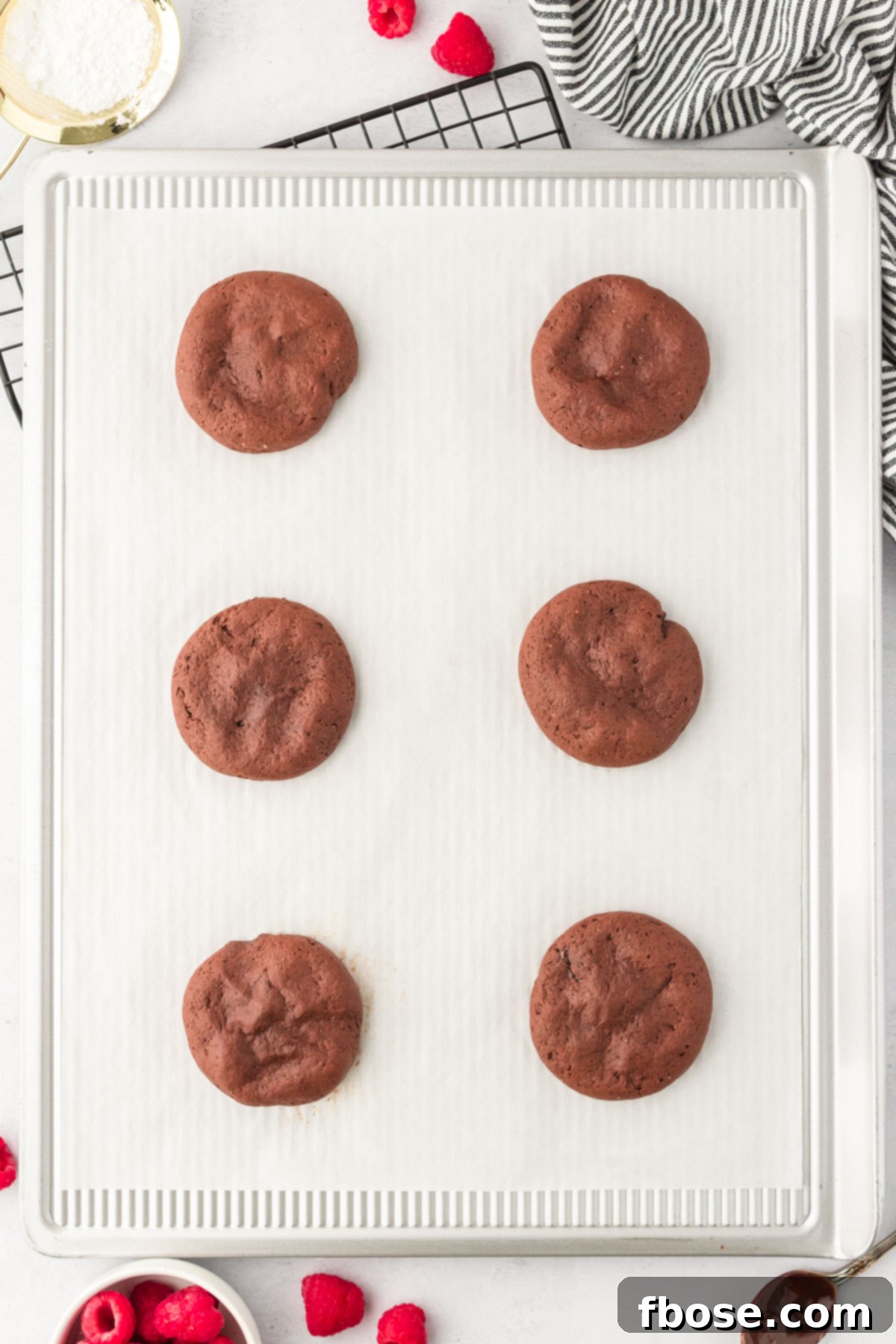 Chocolate cookies on a baking sheet. 