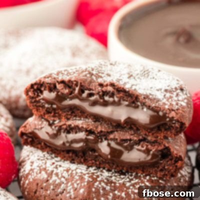 Close up of two halves of a lava cake cookie on another cookie.