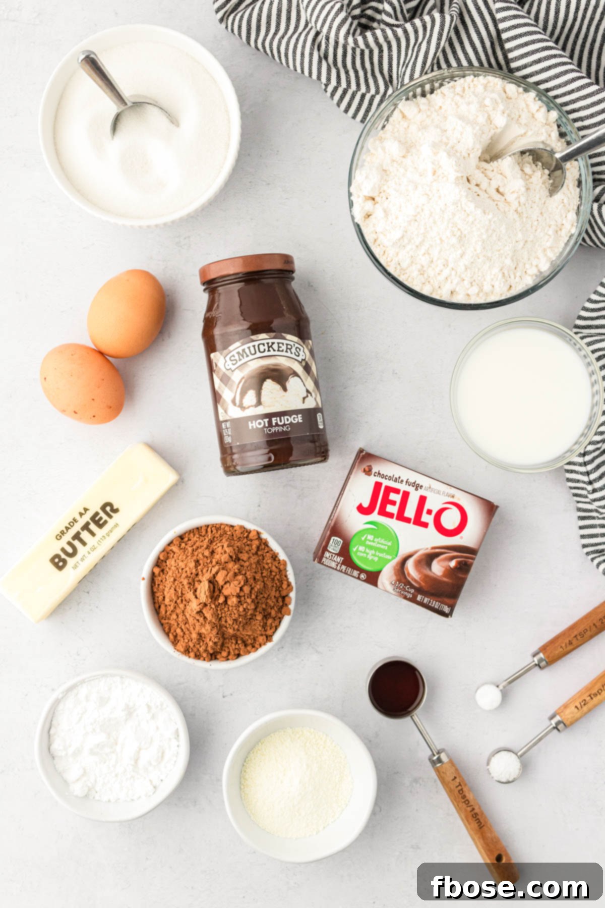 Ingredients to make lava cake cookies on a white counter.