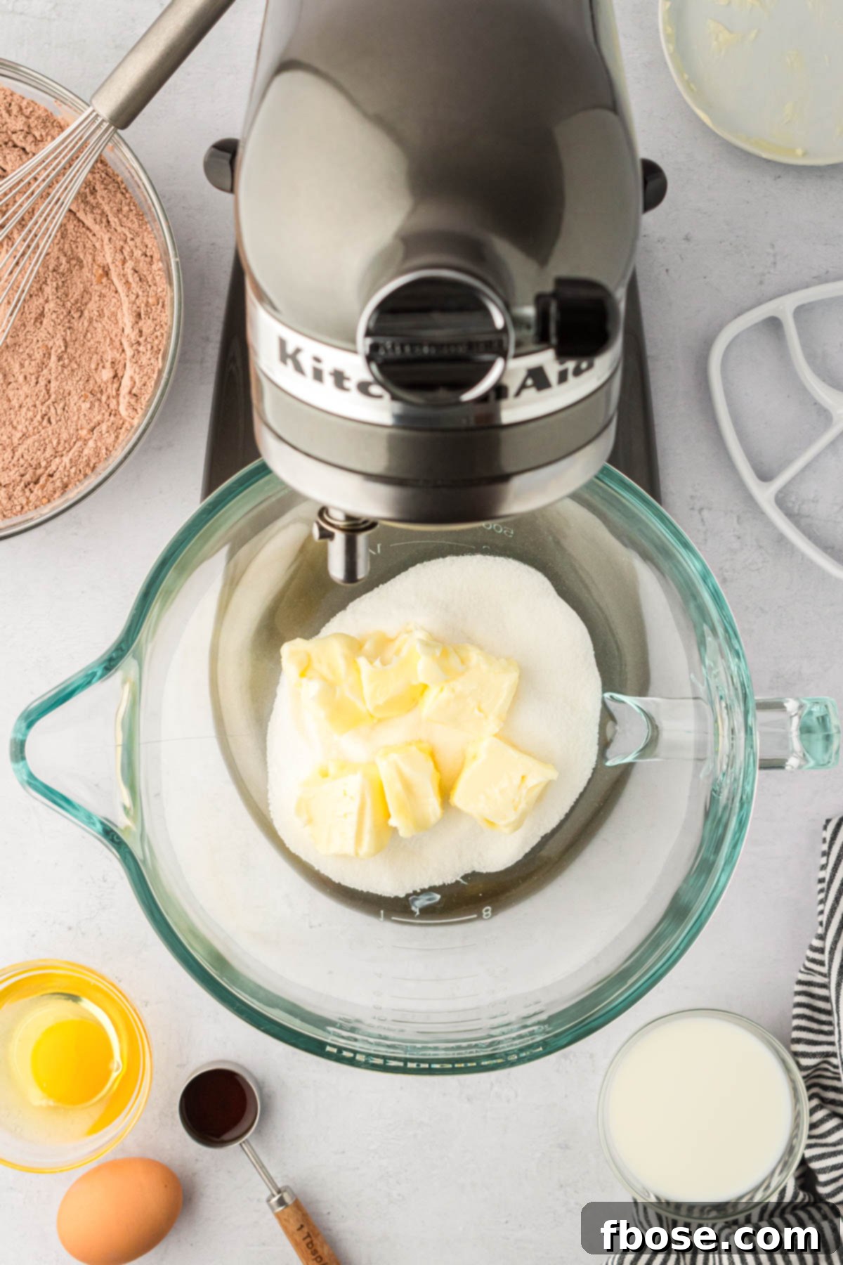 Butter and sugar ready to be creamed together in a glass stand mixer. 