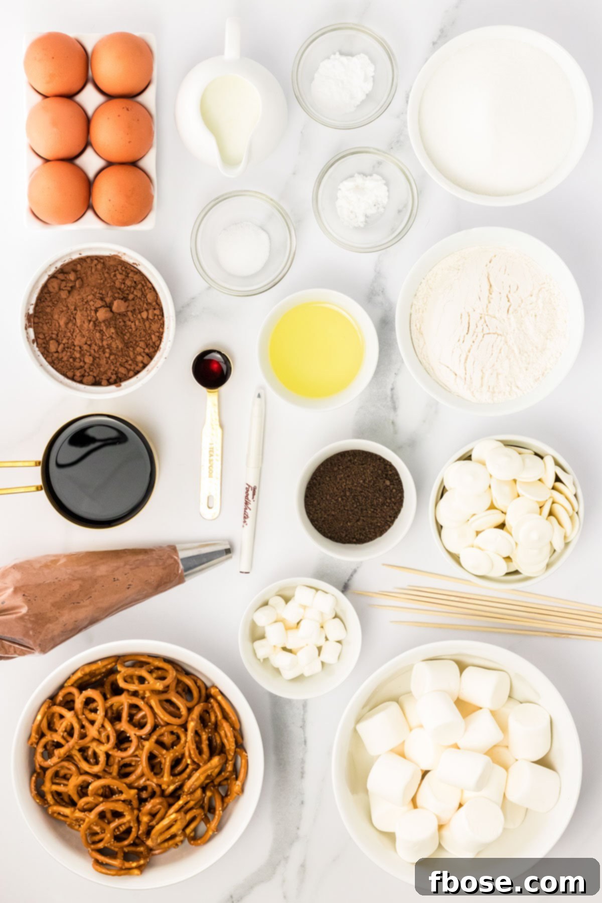 Spooky Skeleton Cupcakes 4 Overhead photo of ingredients to make skeleton cupcakes on a counter.