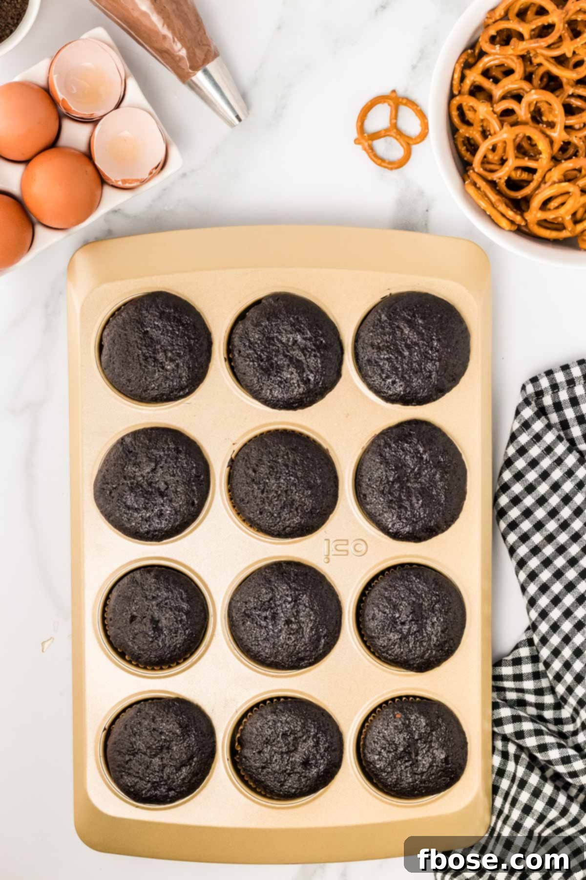 Spooky Skeleton Cupcakes 5 Chocolate cupcakes in a pan.