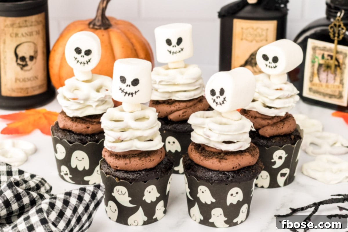 Spooky Skeleton Cupcakes 7 Skeleton cupcakes on a white table.