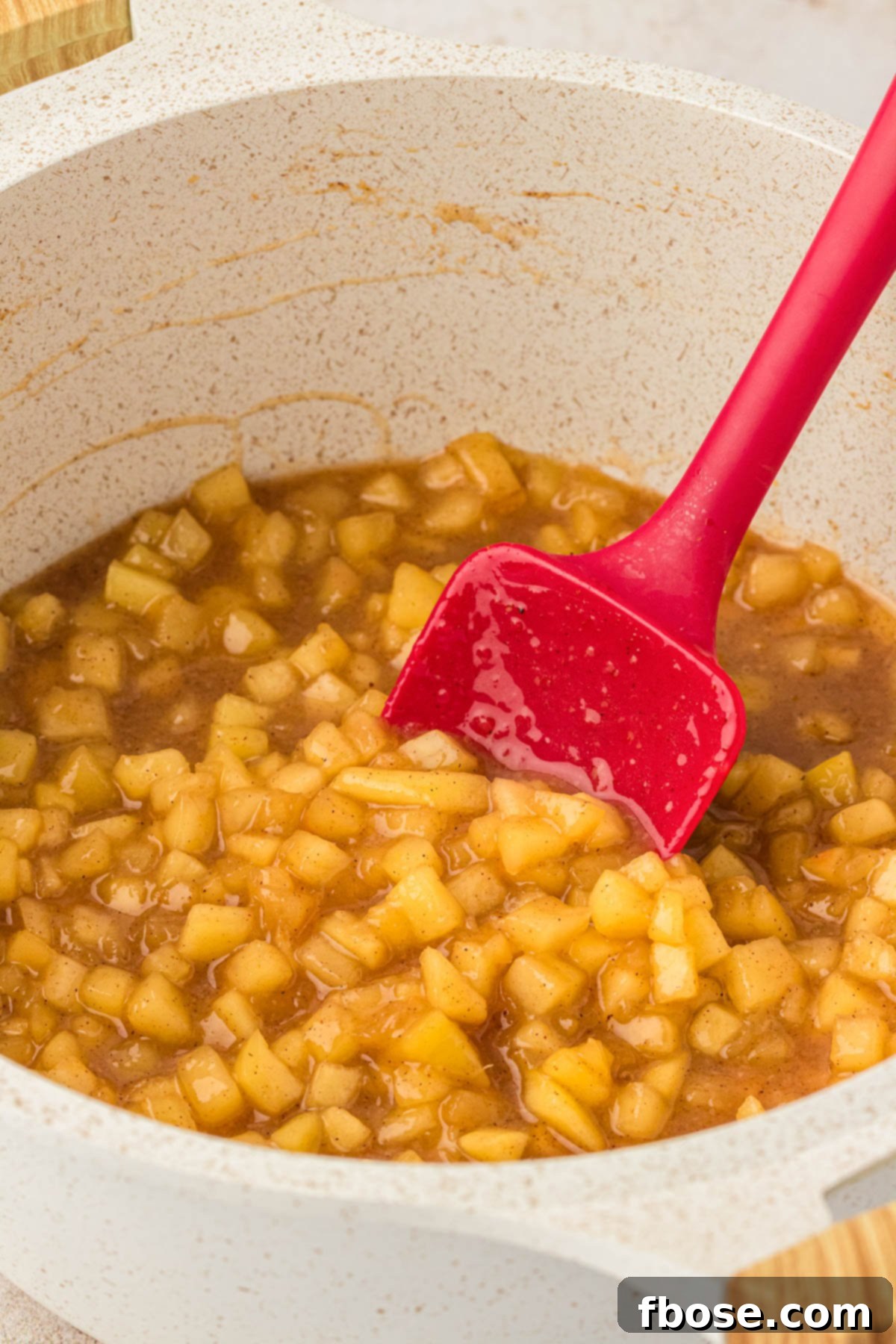 Apple pie filling for cookies in a saucepan.