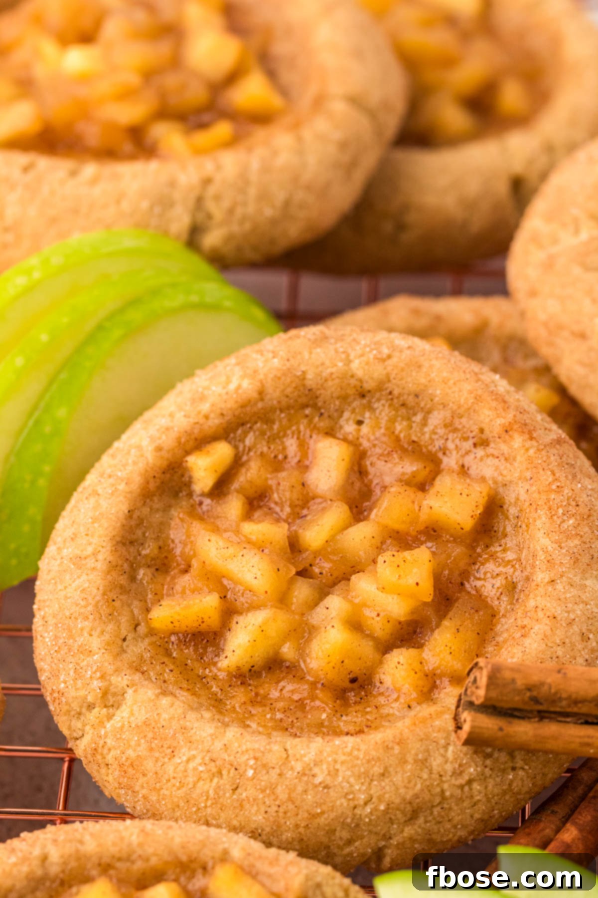 Close up of apple pie cookies on a wire rack. 
