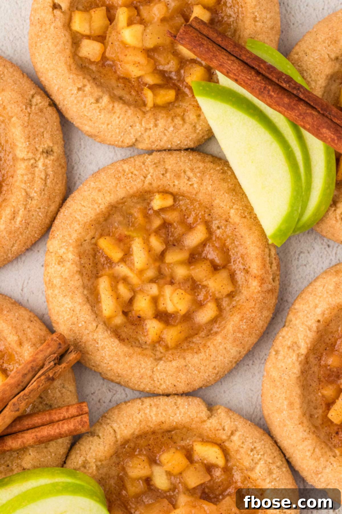 Overhead photo of apple pie cookies on a counter.