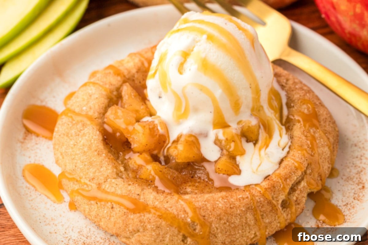 Apple pie cookies with ice cream on a plate.