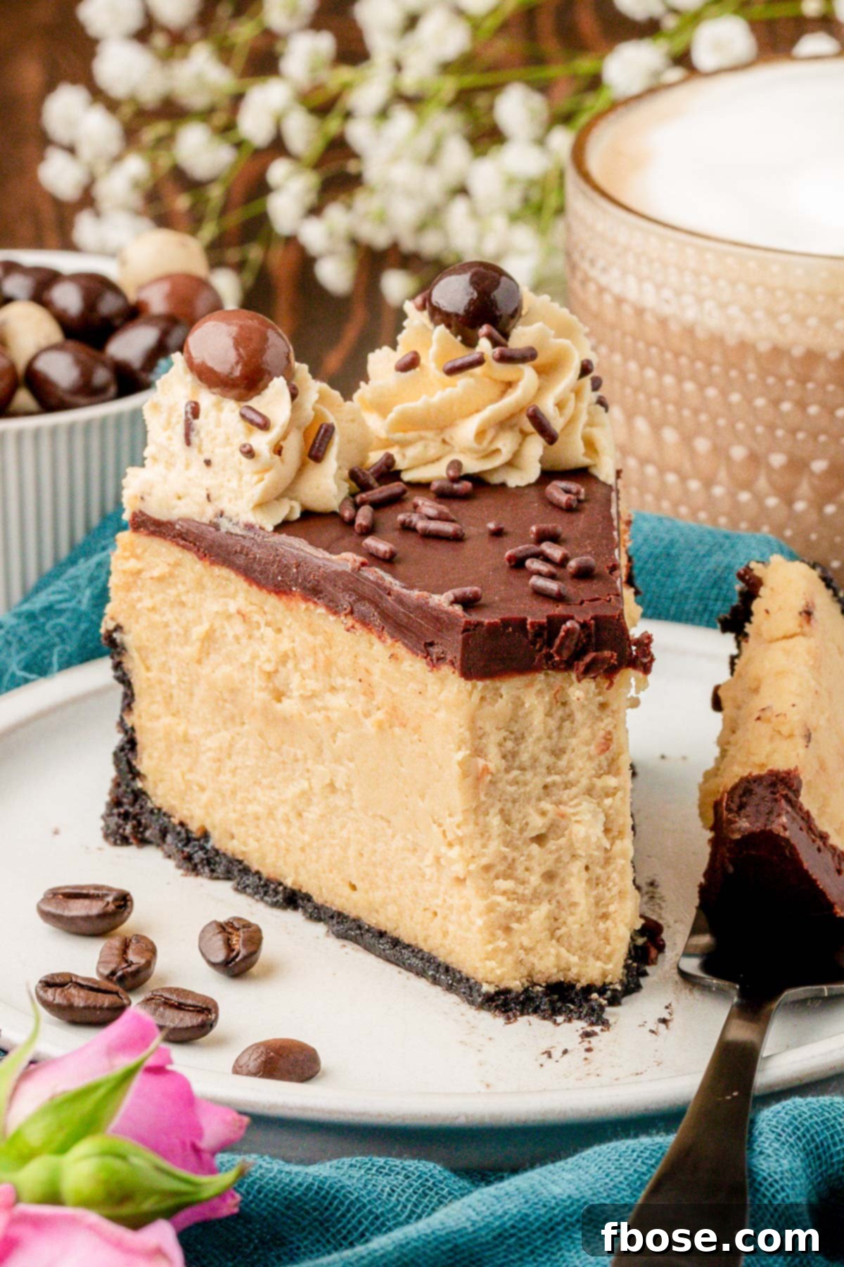 Gourmet Coffee Cheesecake 2 A slice of coffee cheesecake on a white plate with a bite missing.