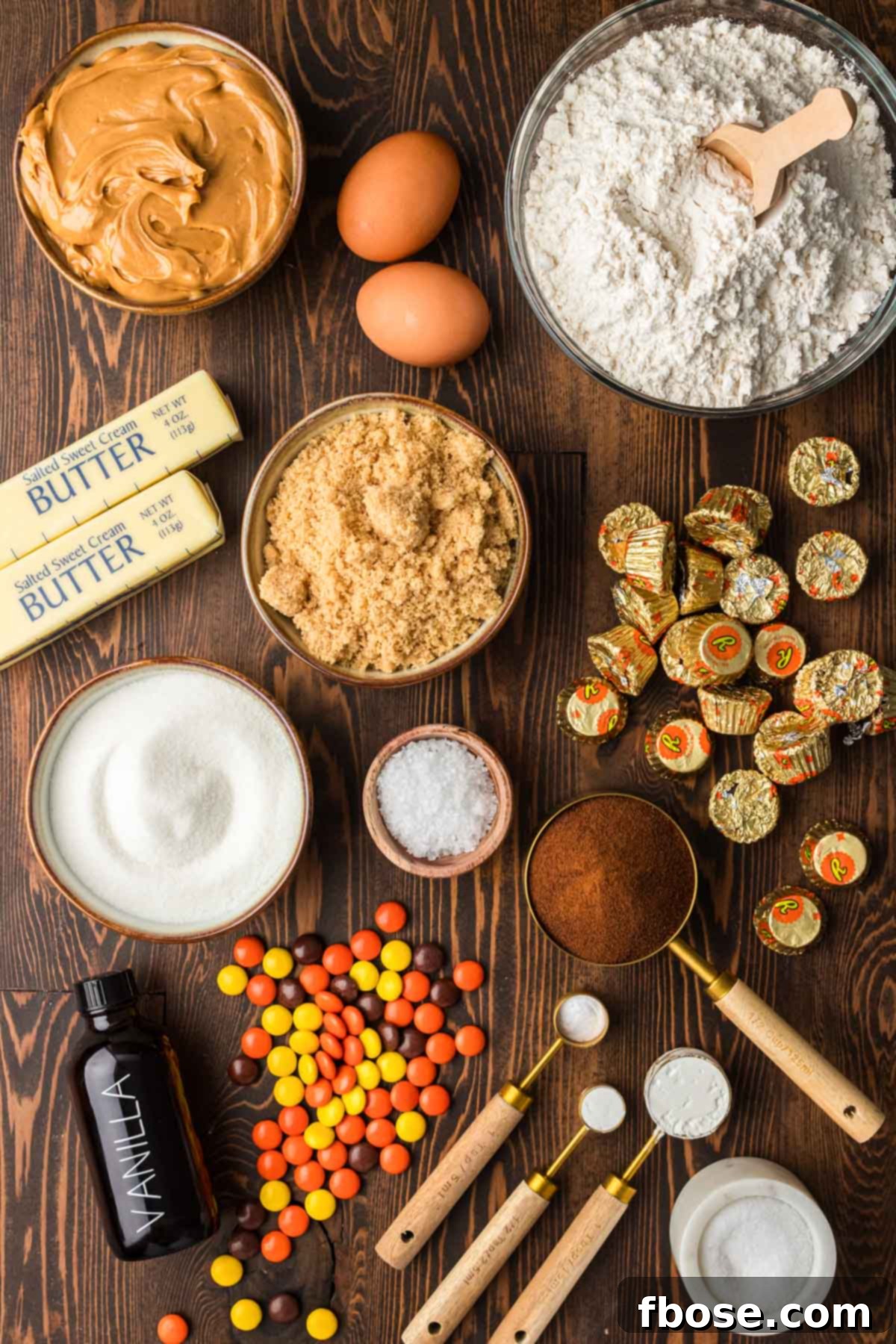 Overhead photo of various ingredients laid out on a wooden table, ready to make Gideon's Bakehouse-inspired peanut butter cold brew cookies.