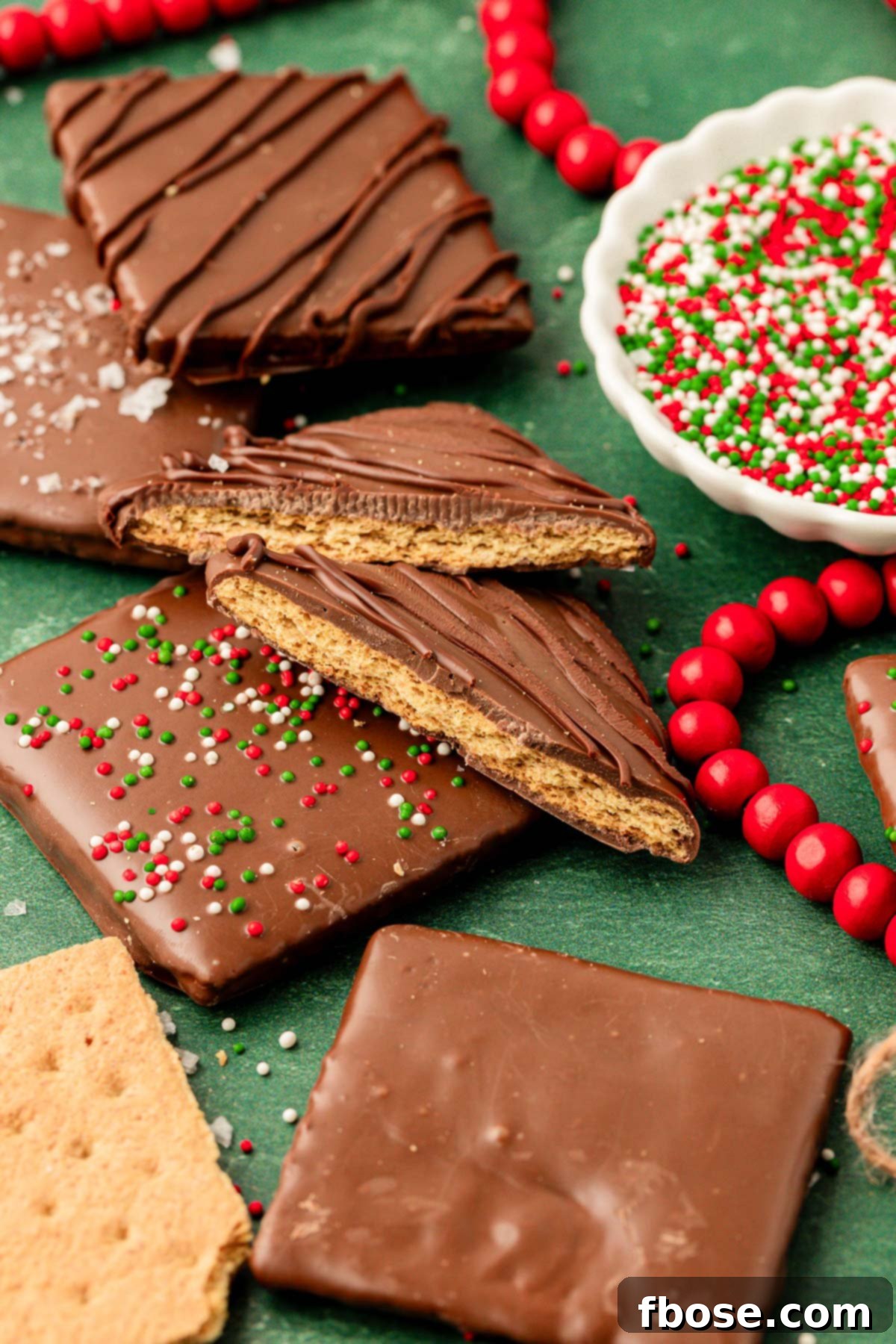 Chocolate Graham Delights 2 Close up of chocolate covered graham crackers for the holidays on a green counter.