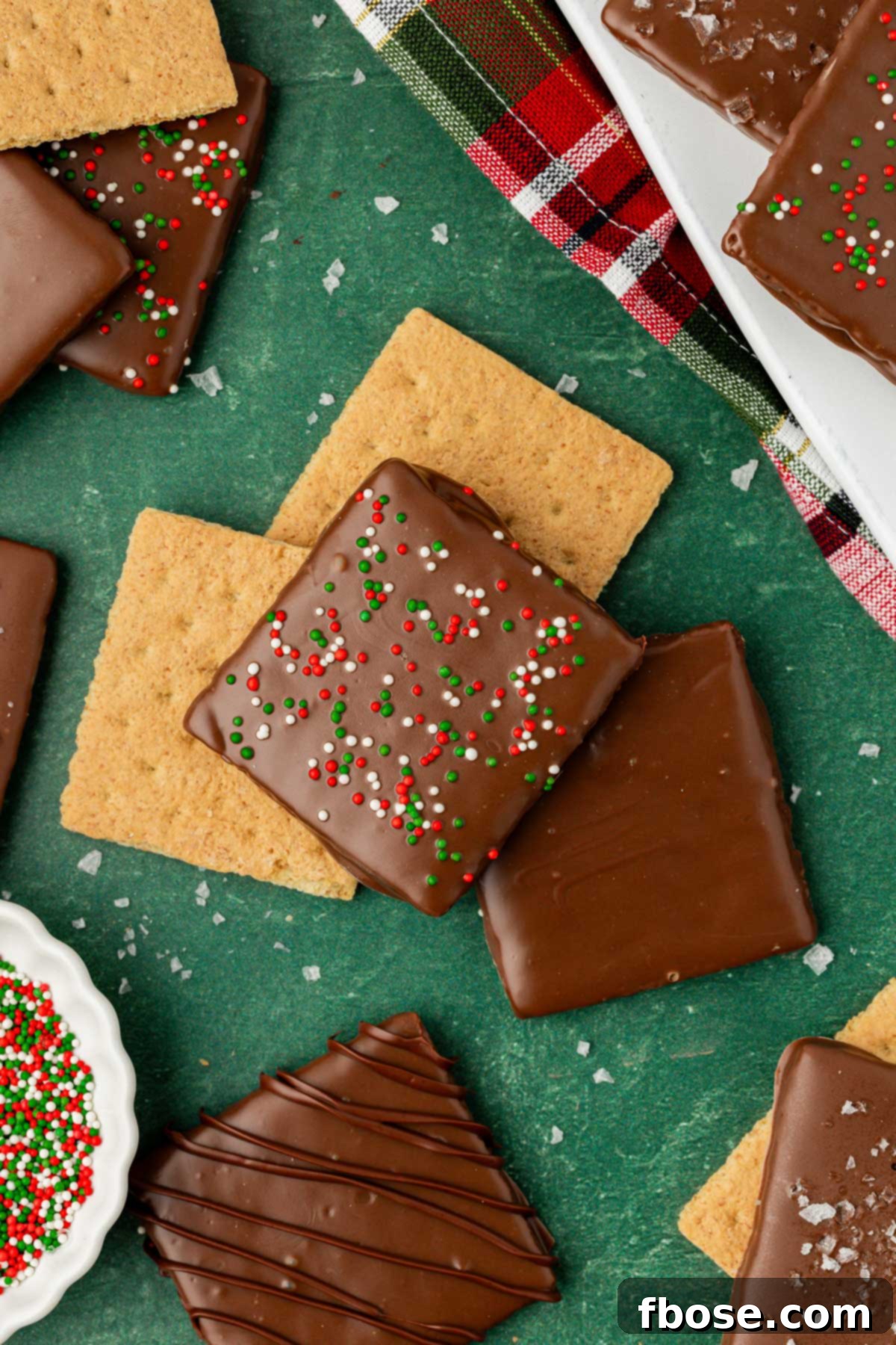 Chocolate Graham Delights 9 Christmas chocolate coated graham crackers on a green table.