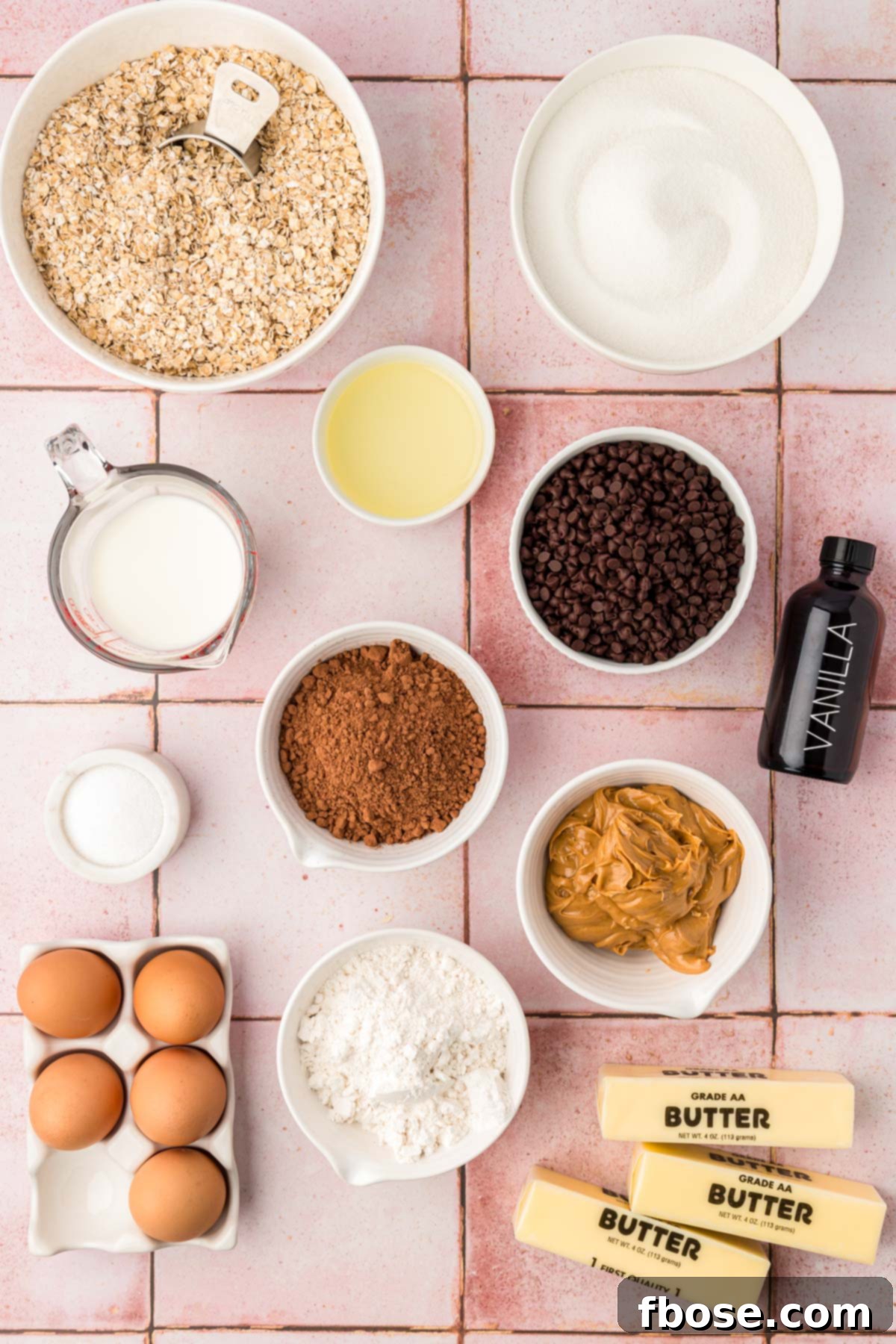 Effortless Fudgy Cookie Brownie Bars 4 Ingredients to make no bake brownie cookies on a pink table.