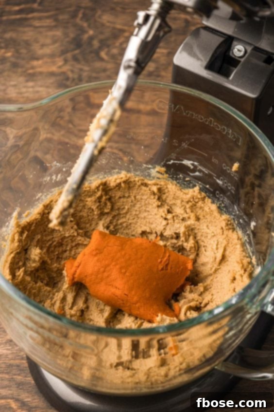 Pumpkin puree in creamed butter and sugar.