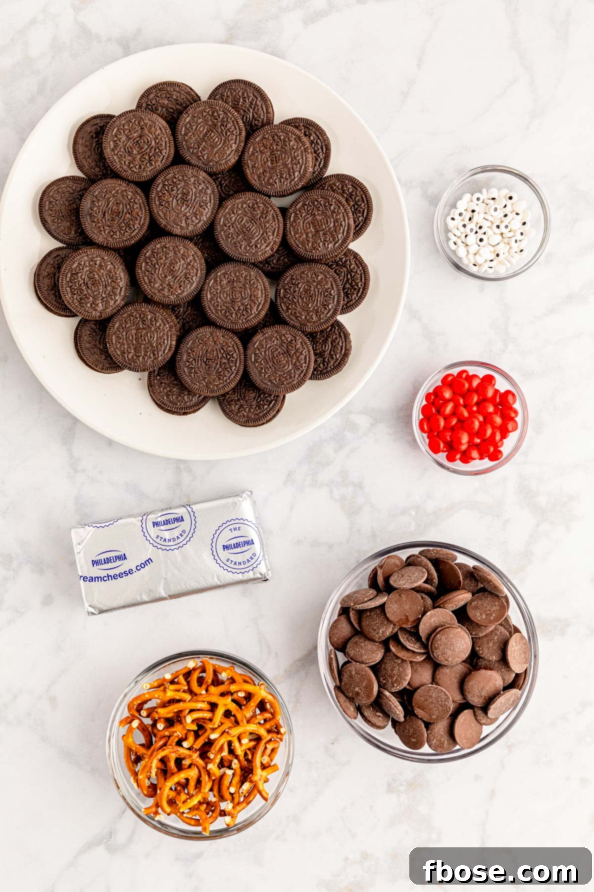 Overhead photo of all the simple ingredients laid out on a marble counter, ready to make Oreo Balls.