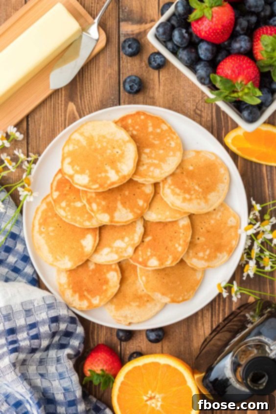 Fluffy Coin Pancakes 16 Mini pancakes on a plate.