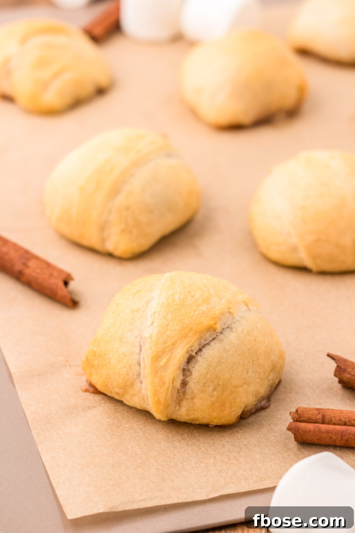 Baked Resurrection rolls on a baking sheet.