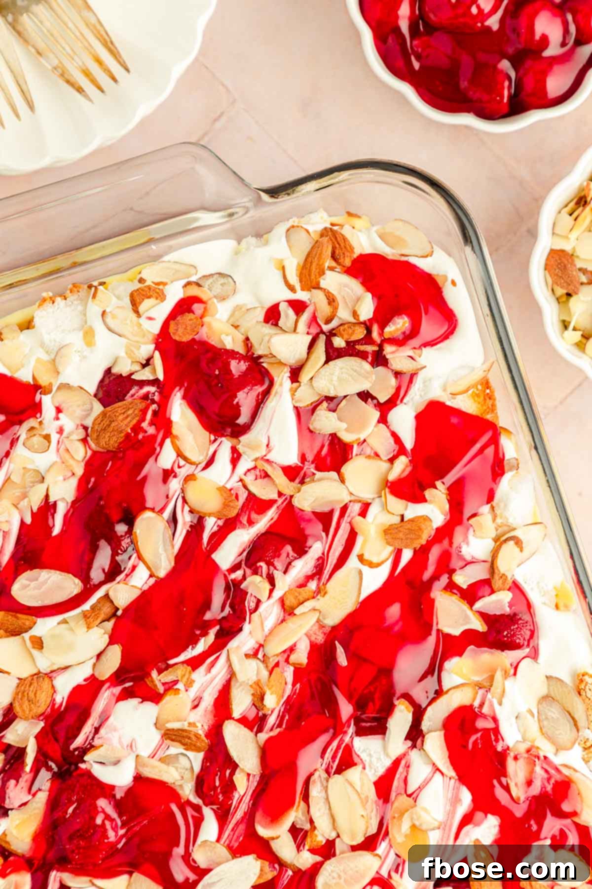 Overhead photo of a glass pan generously filled with the complete Heaven on Earth cake, ready for chilling and serving.
