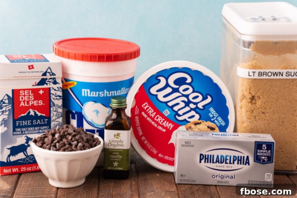 A vibrant flat lay shot displaying all the fresh, high-quality ingredients needed to create the viral Booty Dip recipe, neatly arranged on a rustic wooden table, ready for preparation.