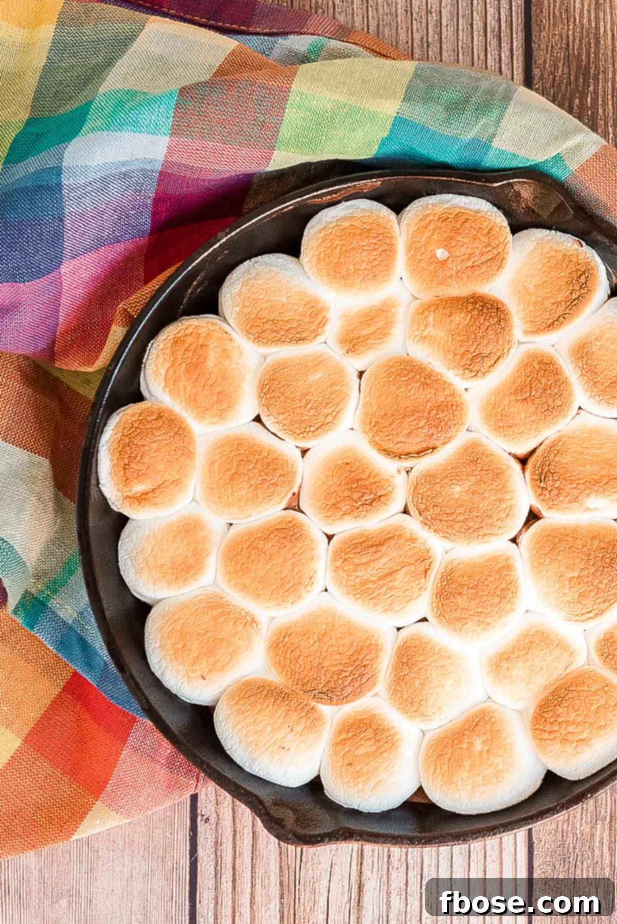 Overhead photo of a cast iron pan filled with s'mores dip.