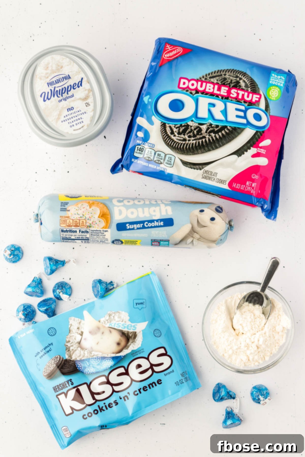 Overhead photo of ingredients to make Oreo thumbprint cookies, neatly laid out on a surface.