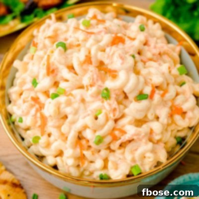 A bowl of Hawaiian macaroni salad on a wooden table.