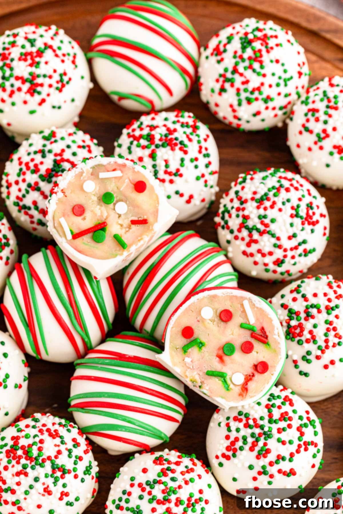 A festive platter of decorated sugar cookie truffles, perfect for Christmas gatherings.