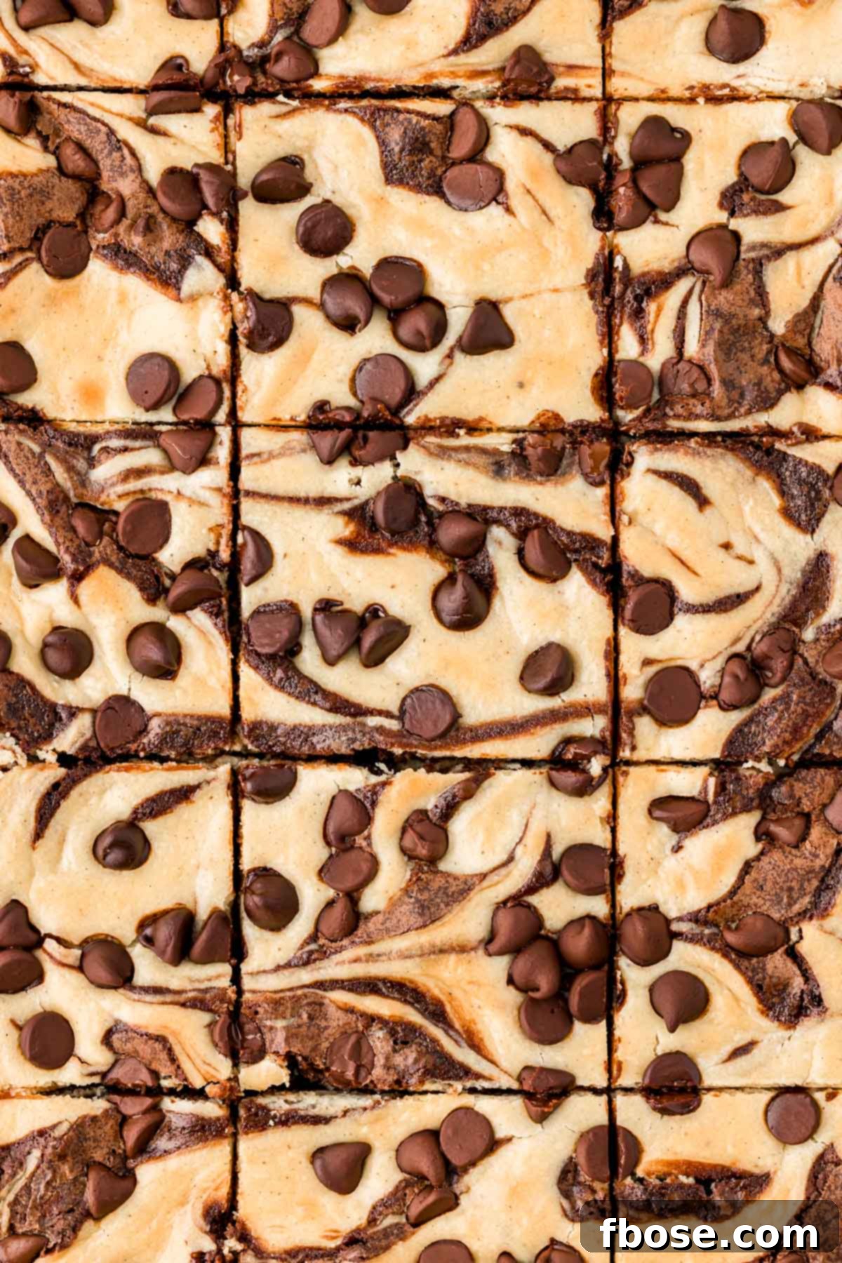 Overhead photo of cream cheese brownies that have just been sliced.