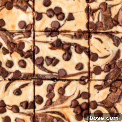 Overhead photo of cream cheese brownies that have just been sliced.
