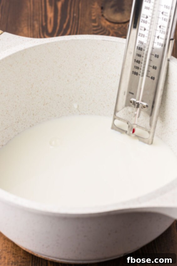 Milk being heated in a saucepan.