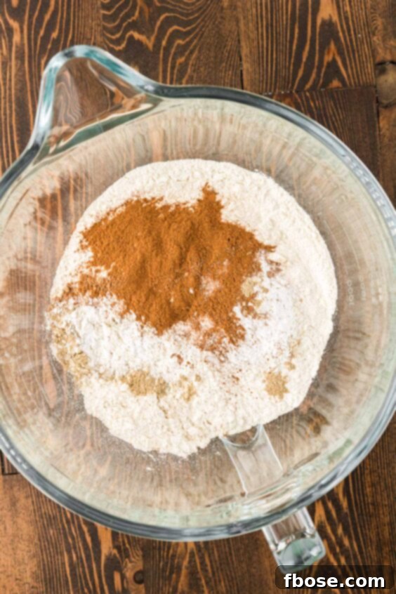 Dry ingredients to make cake in a glass bowl.