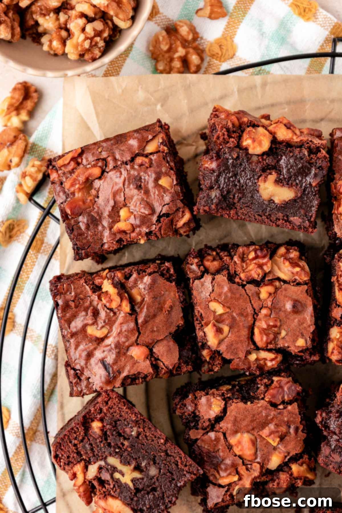 Overhead photo of Walnut brownies slices on a wire rack.