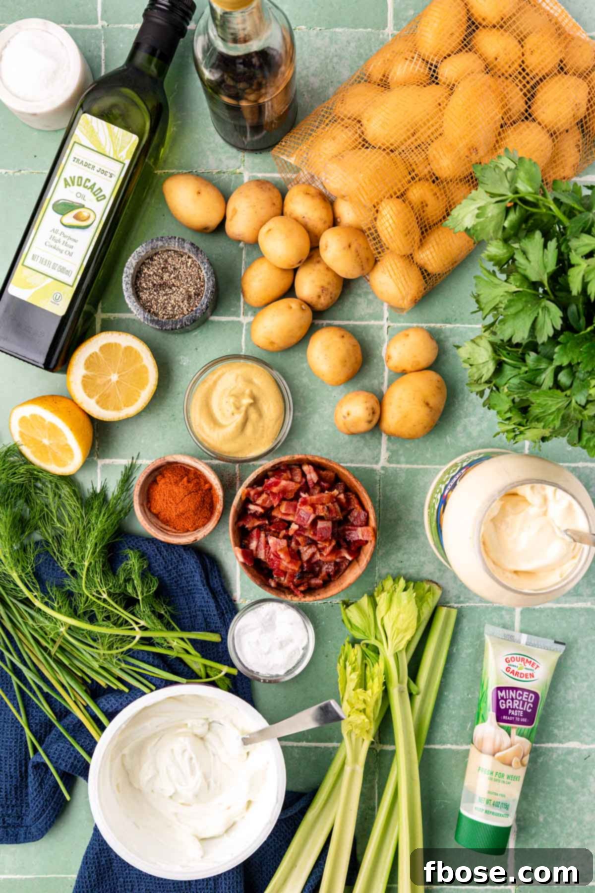 Ingredients to maked potato salad on a table.