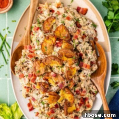 Overhead photo of a serving dish filled with crispy potato salad.