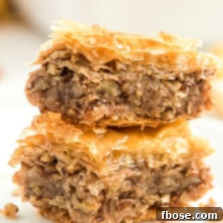 Two pieces of Baklava stacked on top of each other.