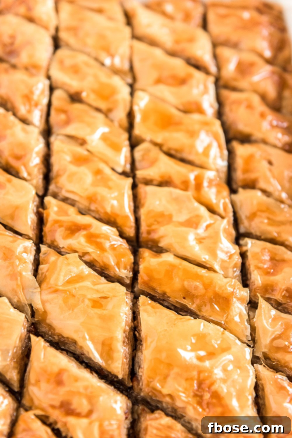 Effortless Homemade Baklava 4 Close up photo of sliced baklava still in baking dish.