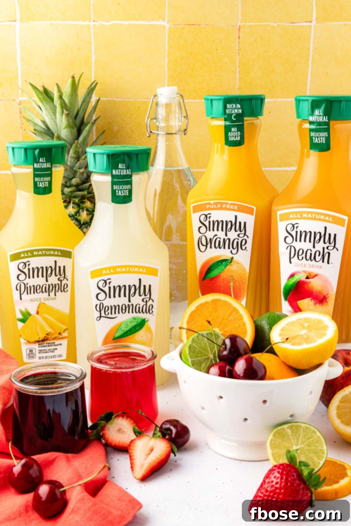 Ingredients to make a summer punch bowl on a table.
