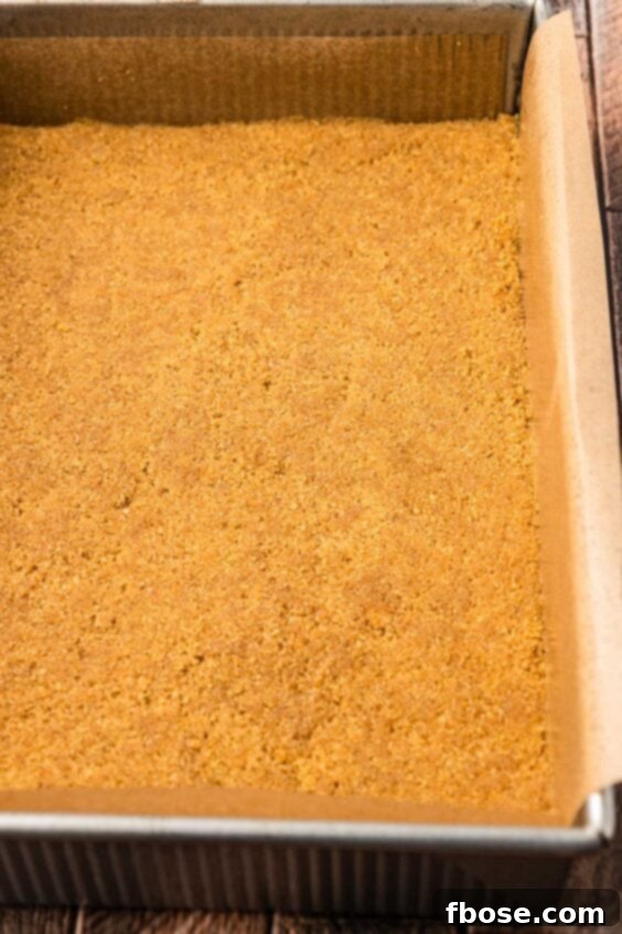 Graham cracker crust in a pan.