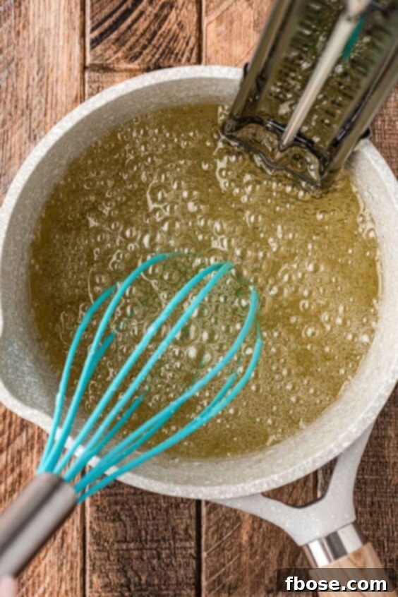 Sugar and water boiling in a pot.