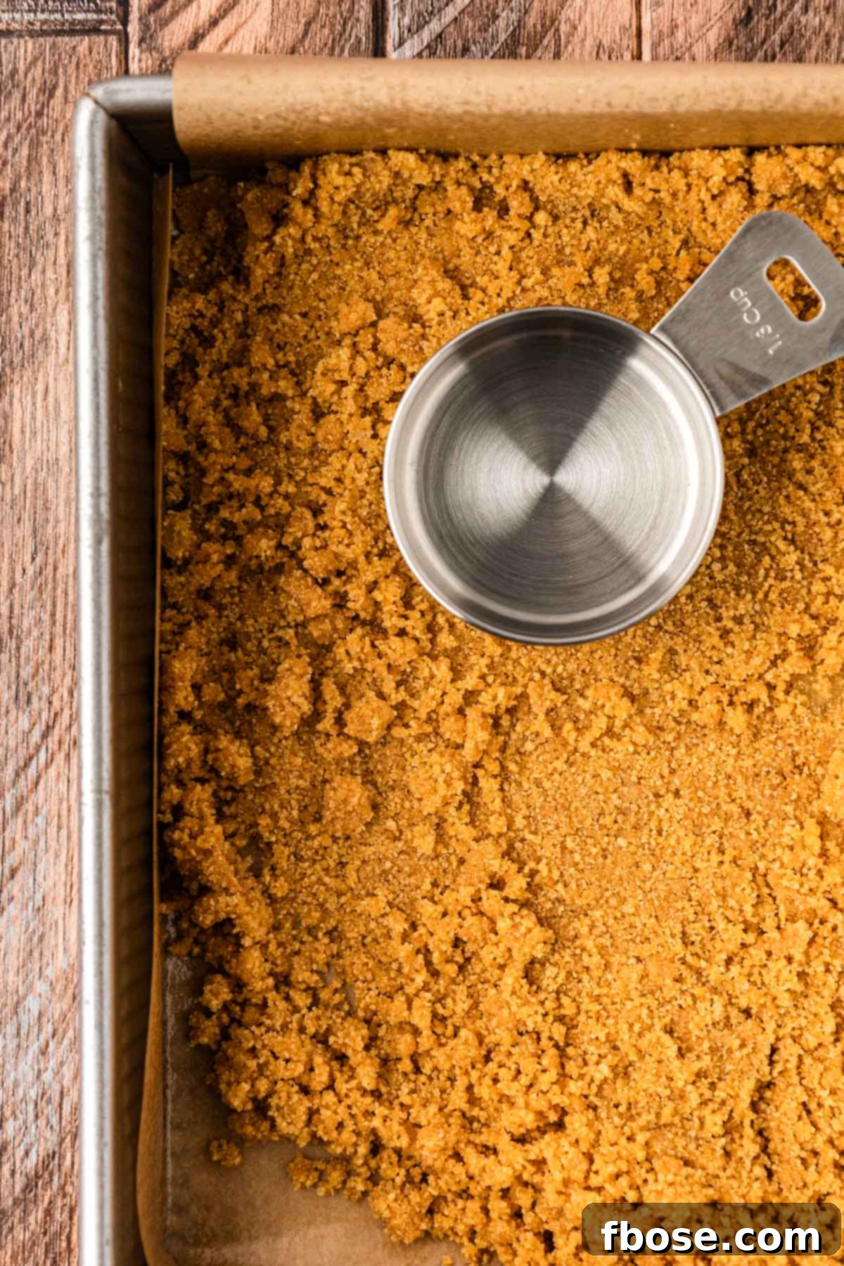 Graham cracker crust in a pan.