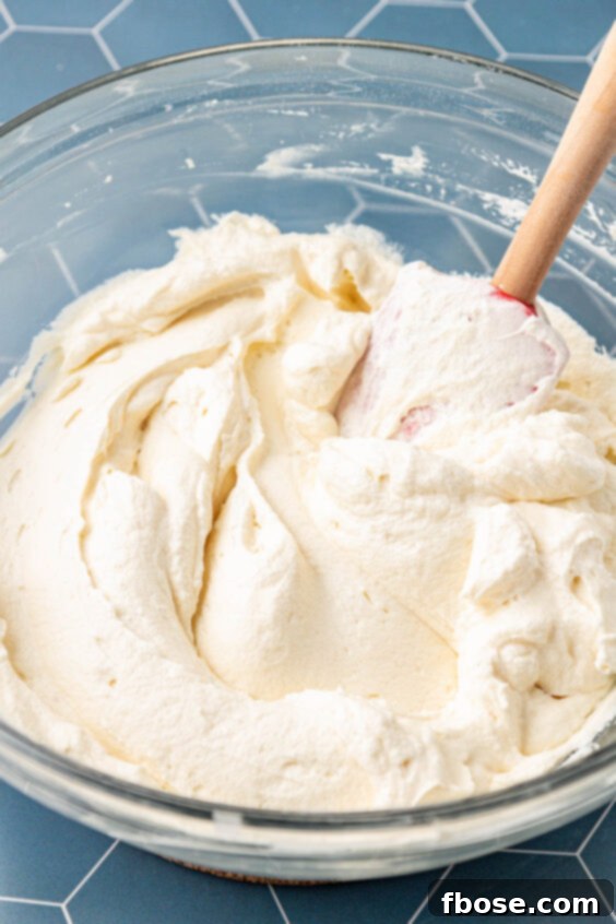 Cream filling for pie in a glass mixing bowl.