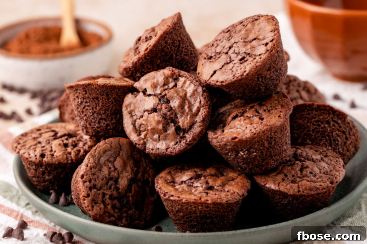A green plate filled with brownie bites.