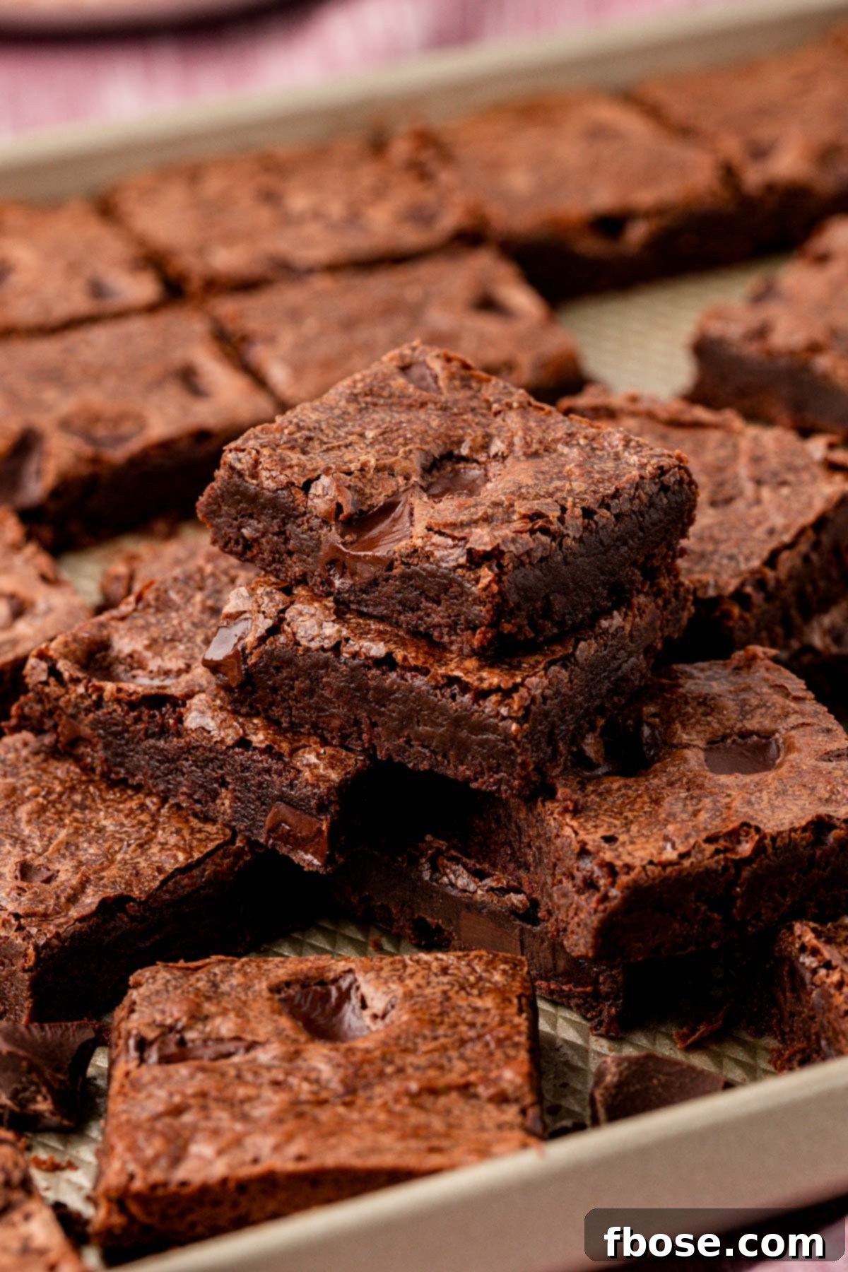 Stacks of brownies on a sheet pan.