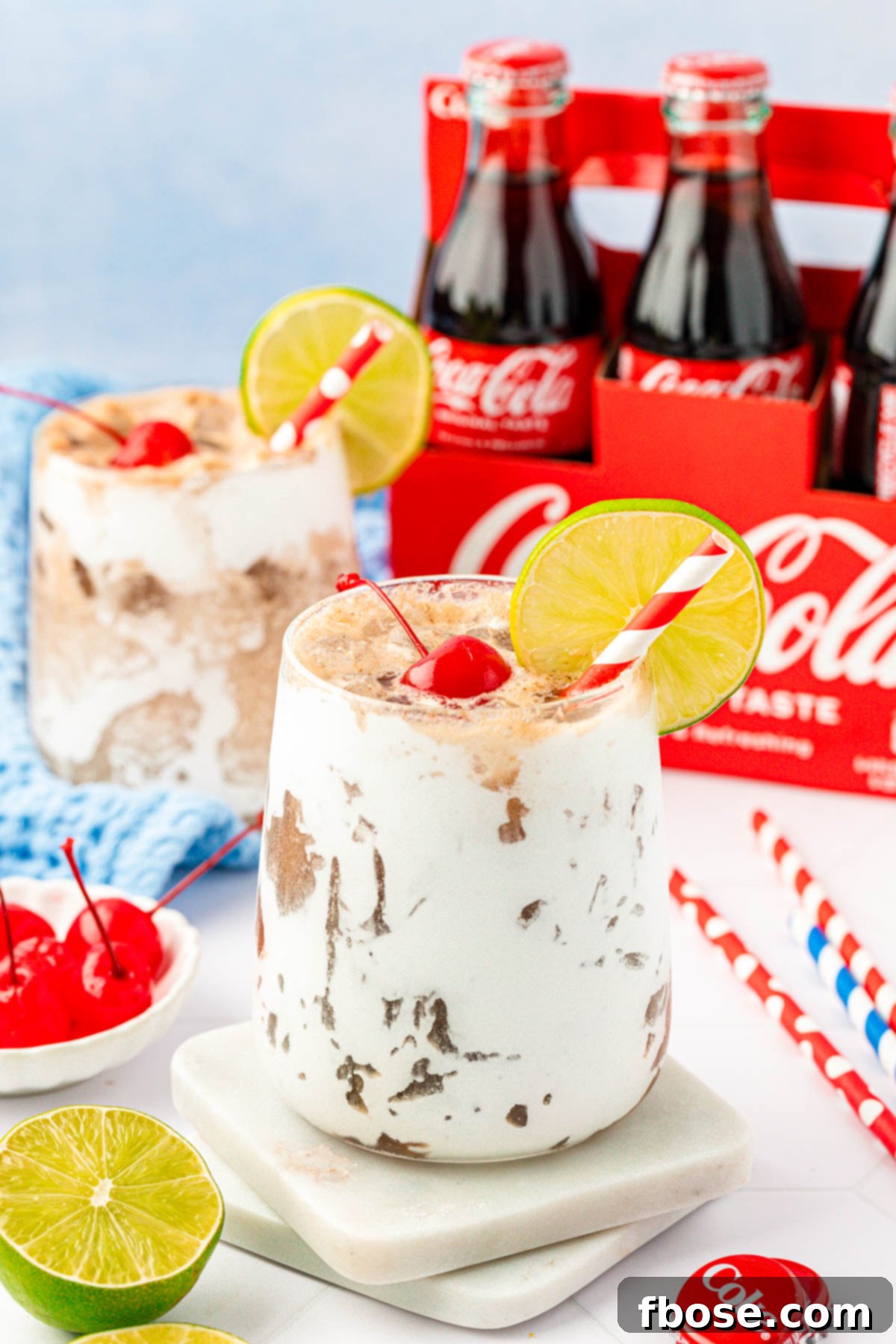 Close up of a Fluffy Coke on a marble coaster.